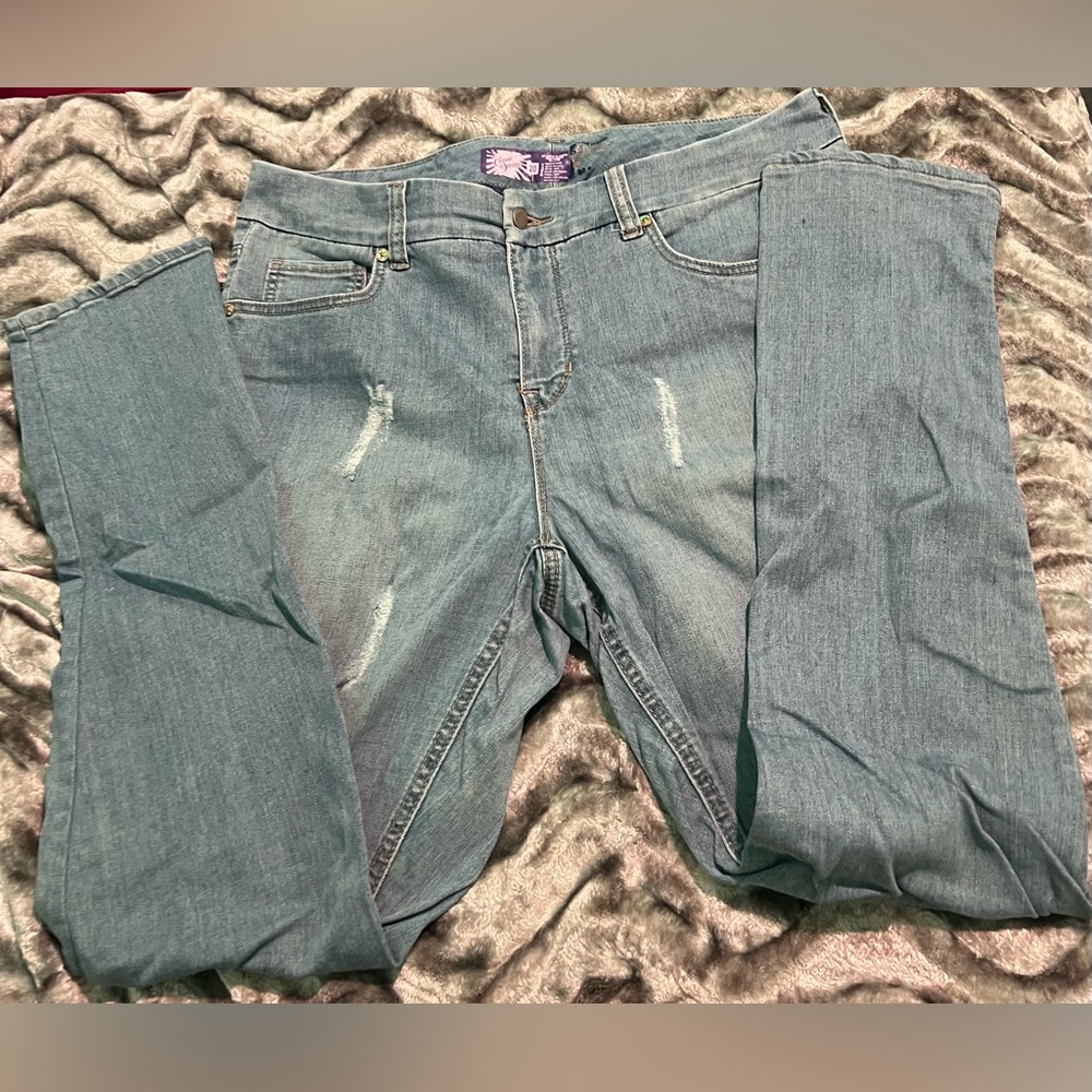 Light blue jeans with rips